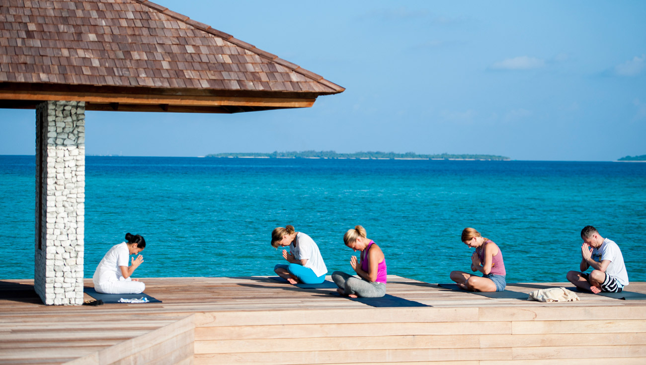Йога на Мальдивах four Seasons